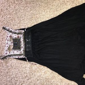 Black dress, floral detail.